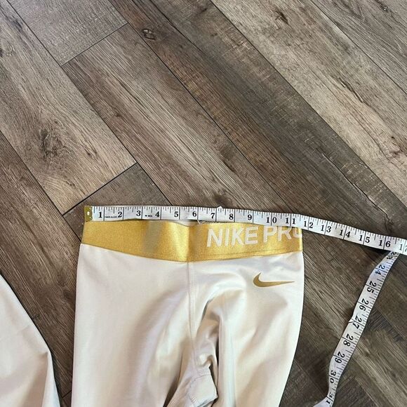 Nike Women's Pro Warm
7/8 Training Tights (Light
Cream/Gold small - Picture 7 of 11